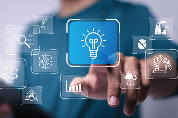 A hand pointing at a lightbulb on a digital screen among many icons.